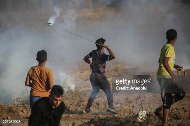 Palestinian demonstrators take part in the "Great March of Return" demonstration with ''Fidelity to Khan Al-Ahmar'' near Israel-Gaza border at...