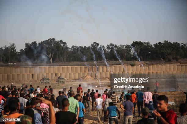 Palestinian demonstrators take part in the "Great March of Return" demonstration with ''Fidelity to Khan Al-Ahmar'' near Israel-Gaza border at...