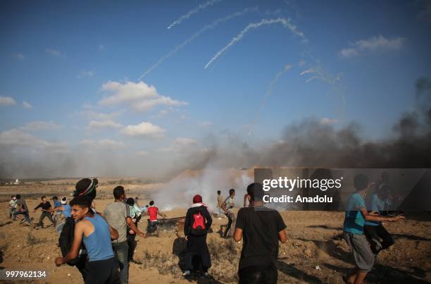 Palestinian demonstrators take part in the "Great March of Return" demonstration with ''Fidelity to Khan Al-Ahmar'' near Israel-Gaza border at...