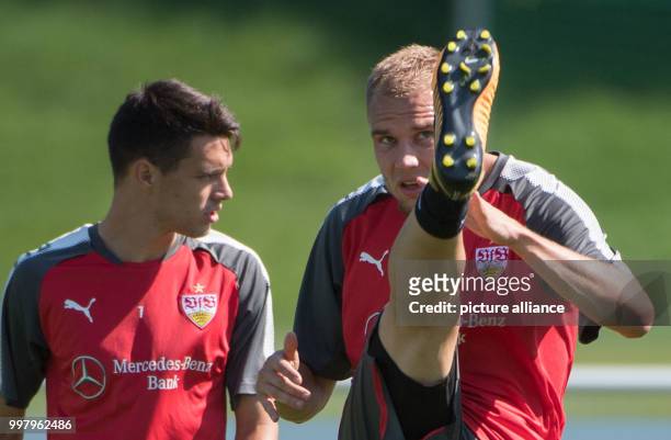 The new member Holger Badstuber talks to Josip Brekalo during the training of German Bundesliga soccer club VfB Stuttgart in Stuttgart, Germany, 07...