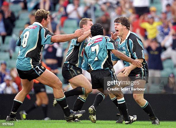 The Sharks celebrate after Martin Lang scores a try during the NRL second semi final match played between the Sharks and the Bulldogs held at the...