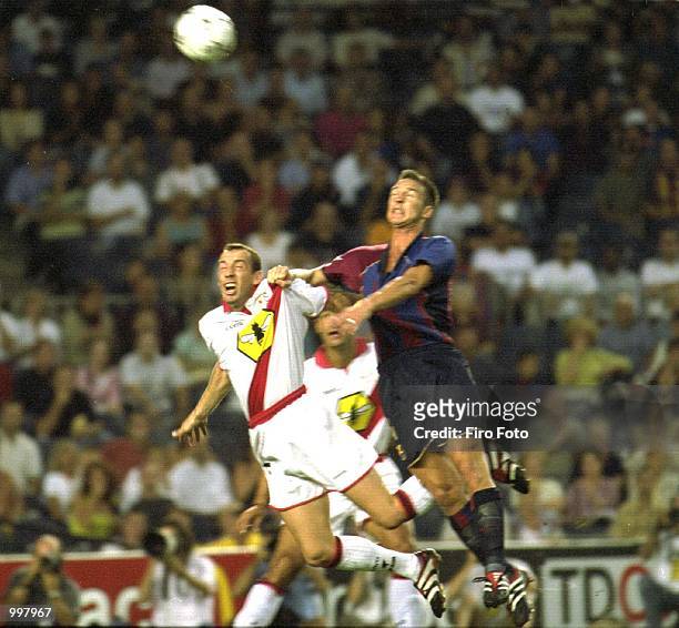Roy of Rayo Vallecano is outjumped by Andersson of Barcelona during the Primera Liga game between Barcelona and Rayo Vallecano played at the Camp Nou...