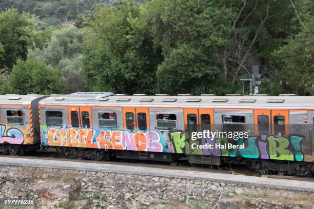 athens train car covered in graffiti - athens vacation photos et images de collection