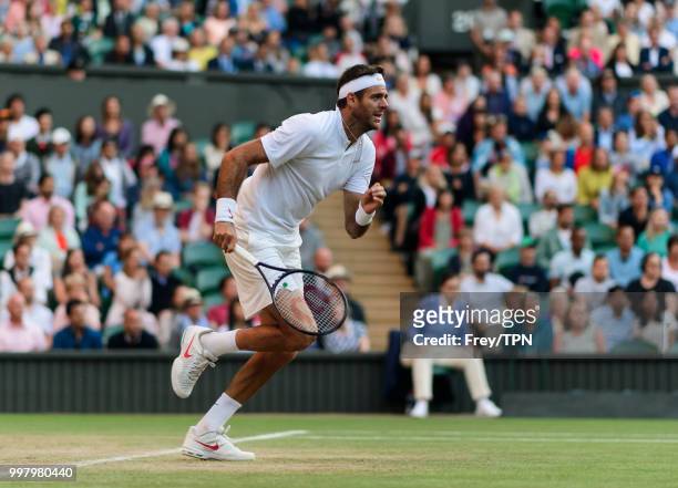 Juan Martin Del Potro of Argentina in action against Rafael Nadal of Spain during the gentlemen's quarter finals at the All England Lawn Tennis and...