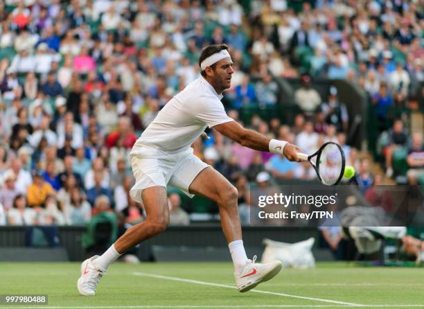 Juan Martin Del Potro of Argentina in action against Rafael Nadal of Spain during the gentlemen's quarter finals at the All England Lawn Tennis and...