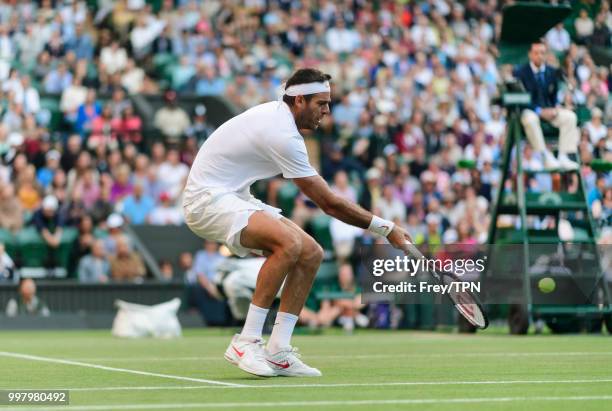 Juan Martin Del Potro of Argentina in action against Rafael Nadal of Spain during the gentlemen's quarter finals at the All England Lawn Tennis and...