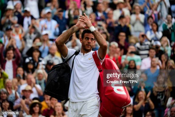 Juan Martin Del Potro of Argentina waves to the crowd after losing to Rafael Nadal of Spain during the gentlemen's quarter finals at the All England...