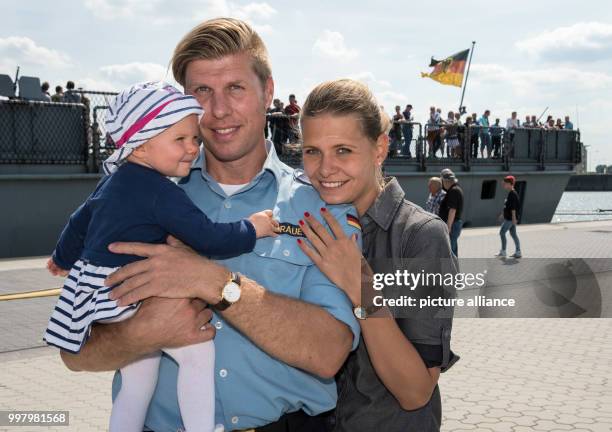 Lieutenant commander Carl Graue from Varel says goodbye to his ten-months old daughter Mathilda and his wife Luisa Tenner in front of the frigate...