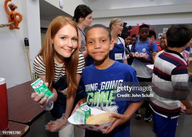 Actress Darby Stanchfield volunteers with Feeding America and the Los Angeles Regional Food Bank to raise awareness around Summer Hunger at the...