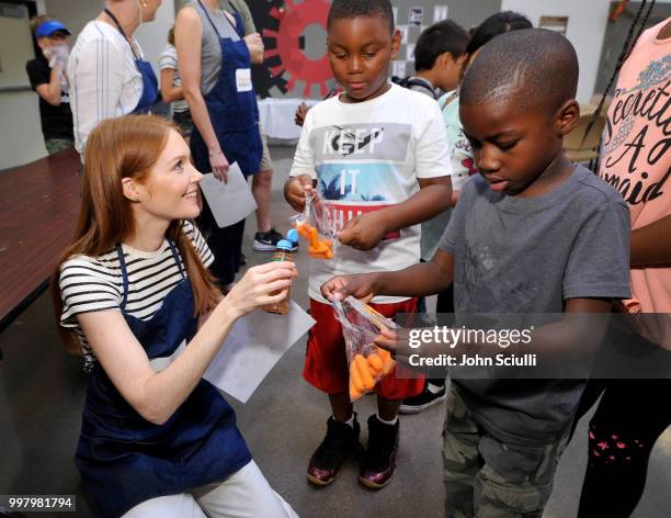 Actress Darby Stanchfield volunteers with Feeding America and the Los Angeles Regional Food Bank to raise awareness around Summer Hunger at the...