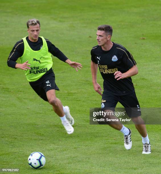 Ciaran Clark controls the ball whilst being challenged by Jamie Sterry during the Newcastle United Training session at Carton House on July 13 in...