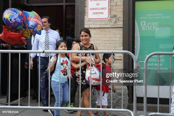Yeni Maricela Gonzalez Garcia walks out with her children from the East Harlem Cayuga Centers on July 13, 2018 in New York City. Gonzalez Garcia,...