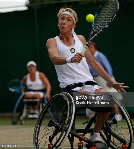 July 13: Sabine Ellerbrock of Germany plays a backhand during the womens doubles wheelchair semi final against Marjolein Buis of The Netherlands and...