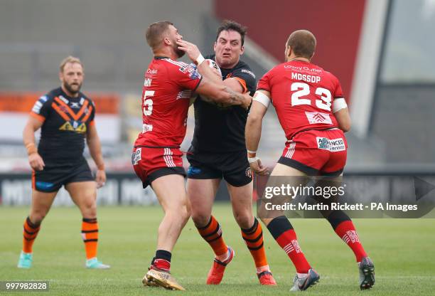 Castleford's Grant Millington is tackled by Salford Red Devils' Ryan Lannon and Lee Mossop during the Betfred Super League match at the AJ Bell...