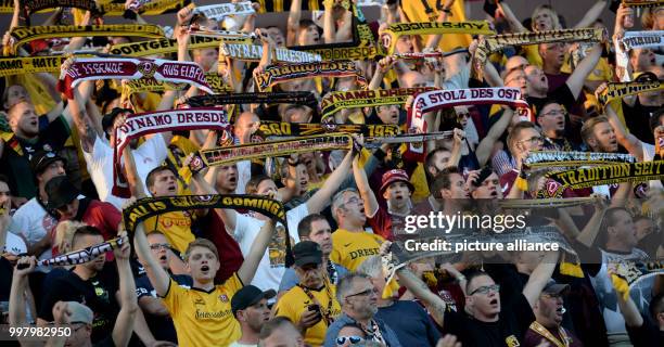 Dresden's fans celebrate before the German 2nd Bundesliga soccer match between 1. FC St Pauli and Dynamo Dresden in the Millerntorstadium in Hamburg,...