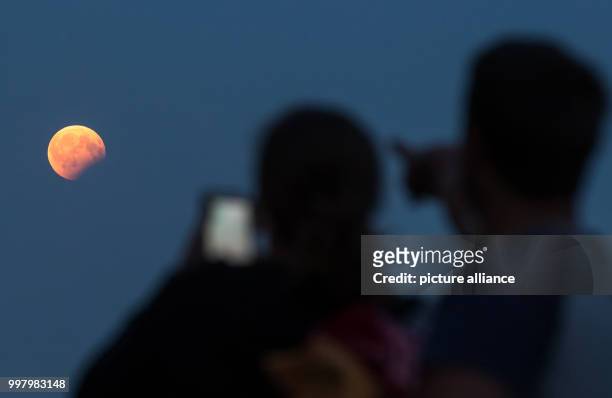Glance at a partial moon eclipse in Berlin, Germany, 07 August 2017. In a partial moon eclipse Sun, Earth and Moon are nearly in one line. Photo:...