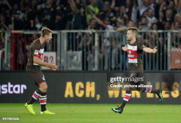 St. Pauli's Christopher Buchtmann celebrates with teammate Daniel Buballa after giving his side a 2:1 lead during the German 2nd Bundesliga soccer...