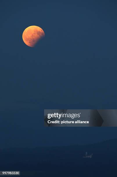 View of the partial moon eclipse in Steingaden, Germany, 07 August 2017. The sun, earth and moon are almost exactly aligned in a partial moon...