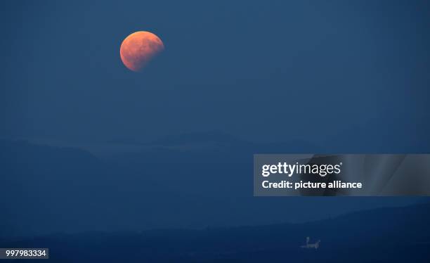 View of the partial moon eclipse in Steingaden, Germany, 07 August 2017. The sun, earth and moon are almost exactly aligned in a partial moon...