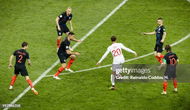 Dele Alli of England is challenged by five players of Croatia during the 2018 FIFA World Cup Russia Semi Final match between England and Croatia at...