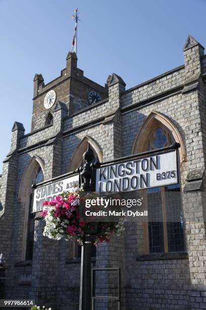 flowering basket and road sign, st peter's church, chertsey - kingston upon thames history stock pictures, royalty-free photos & images