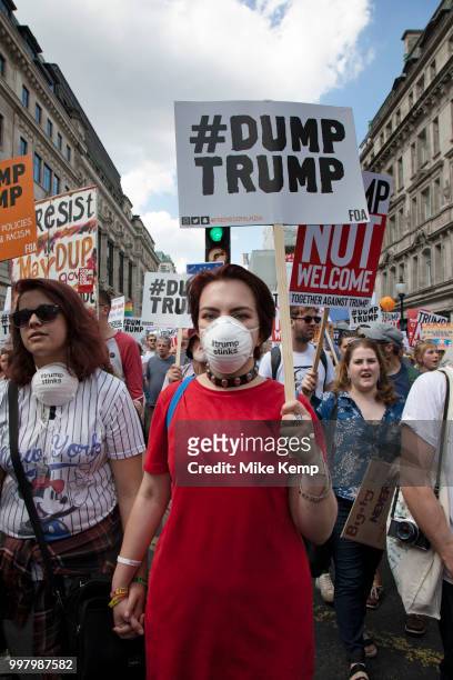 Tens of thousands of protesters gather to march and demonstrate at the Together Against Trump national demonstration on 13th July 2018 in London,...
