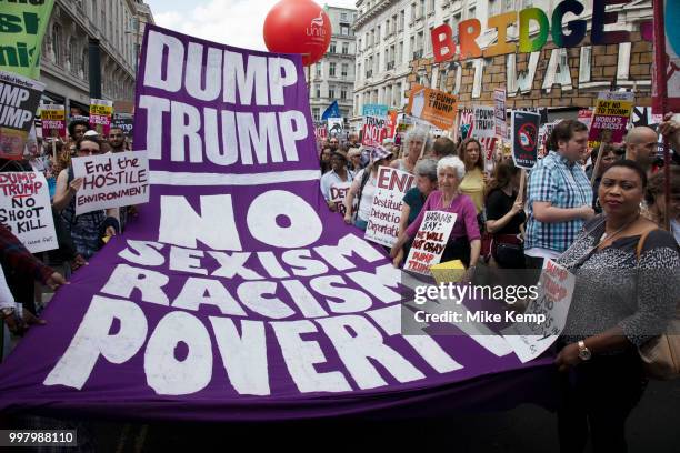 Tens of thousands of protesters gather to march and demonstrate at the Together Against Trump national demonstration on 13th July 2018 in London,...