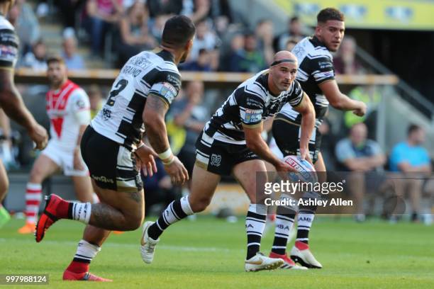 Danny Houghton passes to teammate Hakim Miloudi of Hull FC during the BetFred Super League match between Hull FC and St Helens Saints at the KCOM...