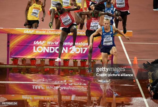 American athlete Evan Jager leads the field in the men's 3000 metre hurdle event at the IAAF London 2017 World Athletics Championships in London,...