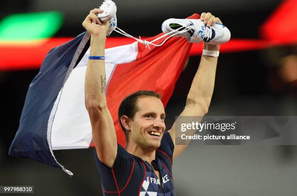 French athlete Renaud Lavillenie celebrates after winning the bronze medal in the men's pole vault event at the IAAF London 2017 World Athletics...