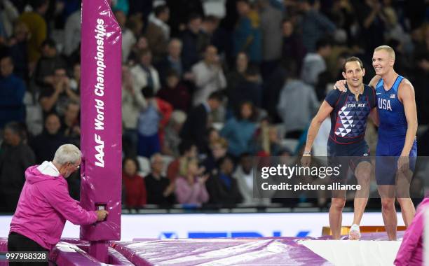 American athlete Sam Kendricks and French athlete Renaud Lavillenie celebrate after winning the gold and bronze medal respectively in the men's pole...