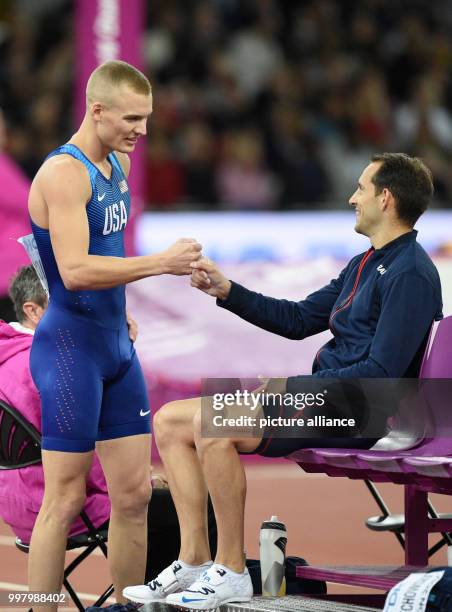 American athlete Sam Kendricks and French athlete Renaud Lavillenie celebrate after winning the gold and bronze medal respectively in the men's pole...