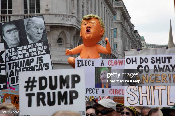 Tens of thousands of protesters gather to march and demonstrate at the Together Against Trump national demonstration on 13th July 2018 in London,...