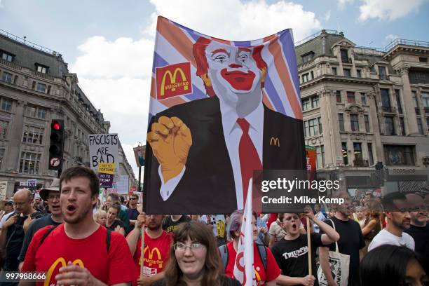 Tens of thousands of protesters gather to march and demonstrate at the Together Against Trump national demonstration on 13th July 2018 in London,...