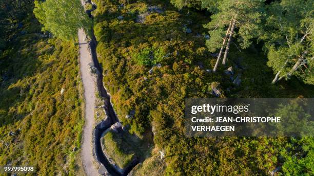 An aerial picture taken on July 11, 2018 near Orbey, eastern France, shows the site of the World War One battlefield at the Collet du Linge in the...