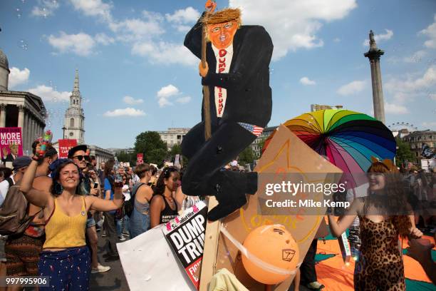 Tens of thousands of protesters gather to march and demonstrate at the Together Against Trump national demonstration on 13th July 2018 in London,...