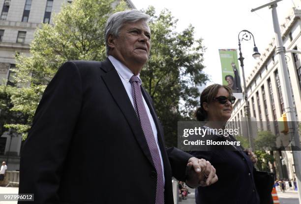 Former State Senate Majority Leader Dean Skelos, left, exits federal court in New York, U.S., on Friday, July 13, 2018. Prosecutors say the...