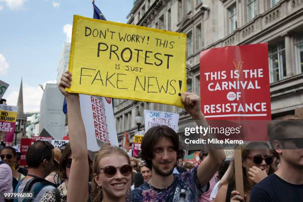 Tens of thousands of protesters gather to march and demonstrate at the Together Against Trump national demonstration on 13th July 2018 in London,...