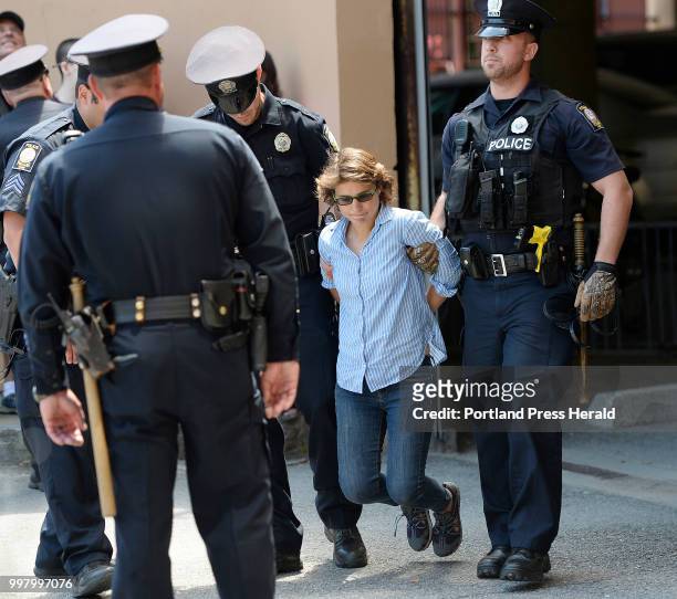 Jessica Stewart of Bass Harbor is arrested protesting the visits of Attorney General Jeff Sessions Friday, July 13, 2018.