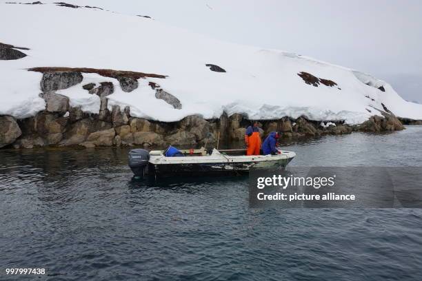 Two fishermen in the fjord of Nuuk, Greenland, 3 May 2017. Around 50 German ex-pats live on the sparsely populated Arctic island. Photo: Julia...