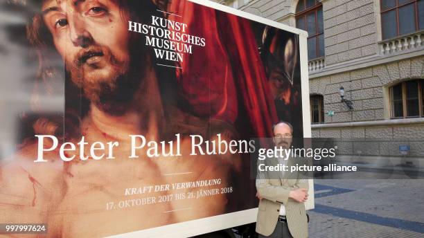 Head of the Gemaeldegalerie gallery in Vienna, Stefan Weppelmann, standing in front of a poster for a Rubens exhibition at the Kunsthistorisches...