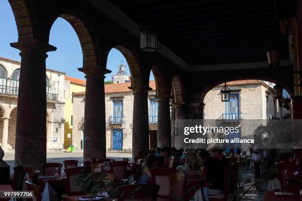 June 2018, Havana, Cuba: A café on the Plaza de la Catedral with the art museum Museo de Arte Colonial. Havana has the largest conserved colonial...