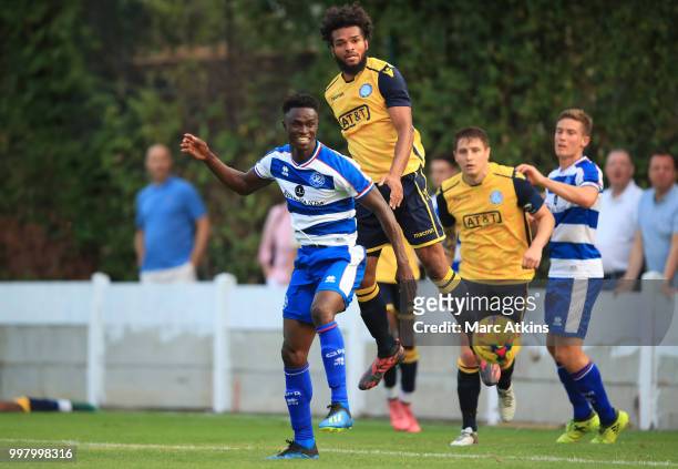 Chevron Mclean of Staines Town in action with Idrissa Sylla of Queens Park Rangers during the Pre-Season Friendly between Staines Town and Queens...