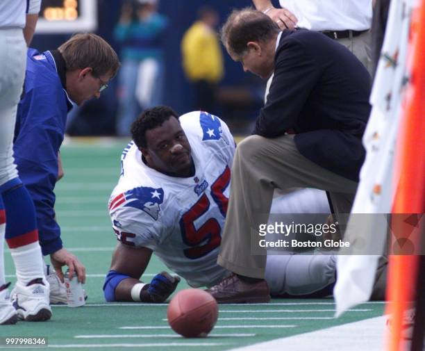 New England Patriots defensive end Willie McGinest lays injured on the field. The New England Patriots visit the Pittsburgh Steelers in a regular...