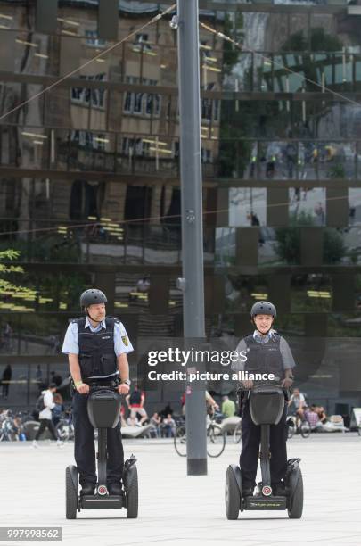 Police officers Matthias Engler and Janka Schmidt on segways in the city centre of Freiburg, Germany, 8 August 2017. The police are to test two...