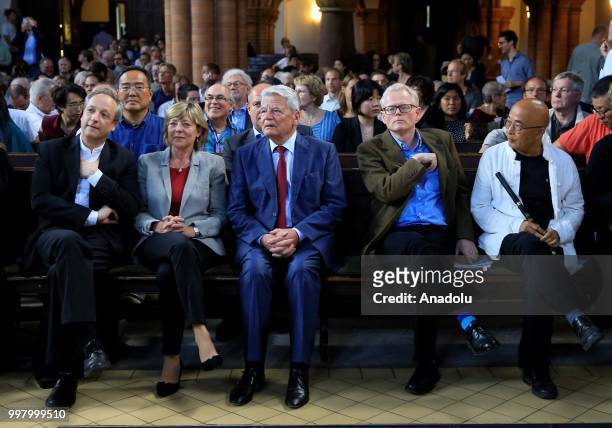 Former German President Joachim Gauck and his partner Daniela Schadt and Pulitzer Prize-winning author and journalist Ian Johnson attend a...
