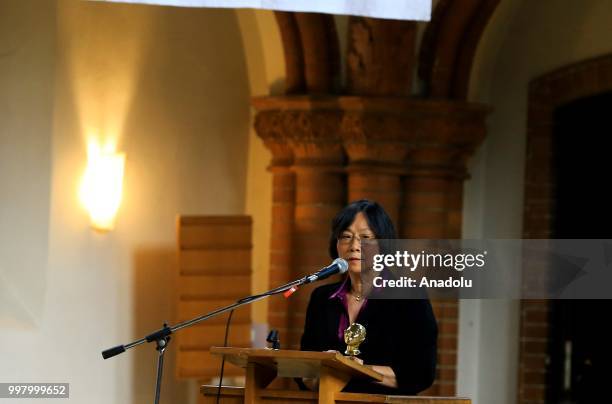 Chinese writer Tienchi Martin Liao addresses during a commemoration for Chinese human rights activist and Nobel Peace Prize laureate Liu Xiaobo at...