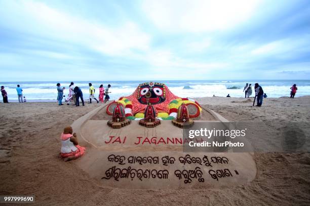 Visitors gathered near Shree Jagannath temple ditties sand sclupture as it is creating by Indian sand artist Sudarshan Pattnaik for visitors...