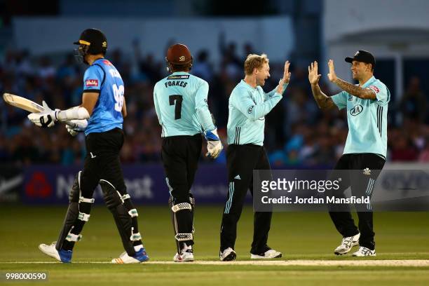 Gareth Batty of Surrey celebrates with his teammates after dismissing David Wiese of Sussex during the Vitality Blast match between Sussex Sharks and...