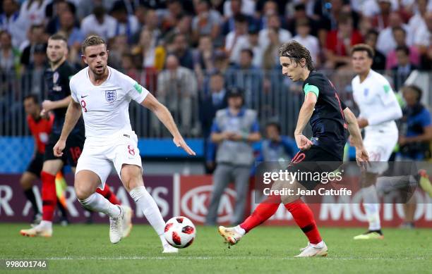 Luka Modric of Croatia, Jordan Henderson of England during the 2018 FIFA World Cup Russia Semi Final match between England and Croatia at Luzhniki...